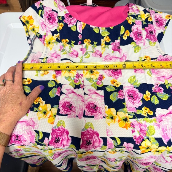 Emma & Michele floral cap-sleeve dress on a navy blue/white striped background. - Picture 7 of 12